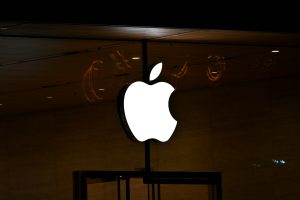 The apple logo is lit up in the dark