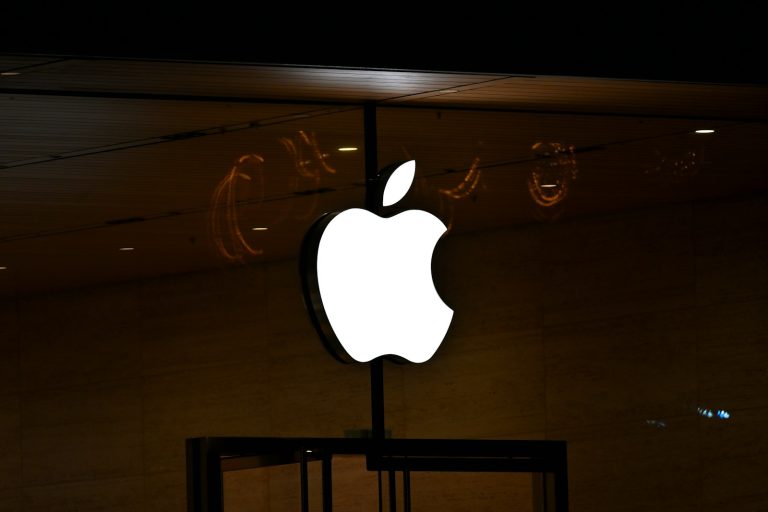 The apple logo is lit up in the dark