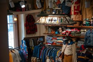 A clothing store with a lot of clothes on display