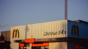 a mcdonald's restaurant with a smoke stack sticking out of the roof