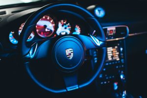 a car steering wheel and dashboard