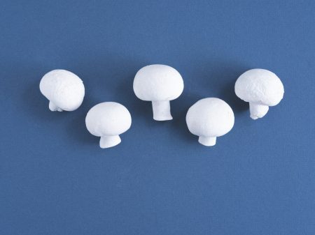 white round wall decor on blue wall