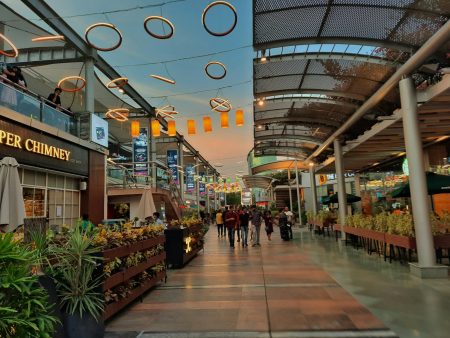 a group of people walking through a shopping mall